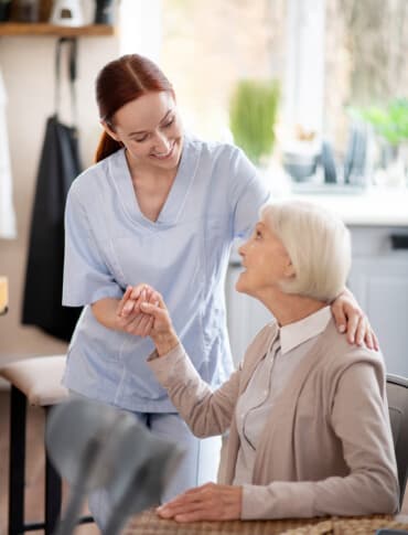 Carer assisting with daily living