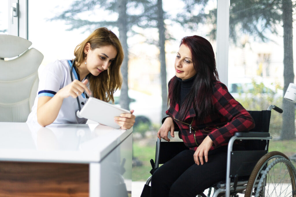Carer helping a participant prepare a meal in their own kitchen