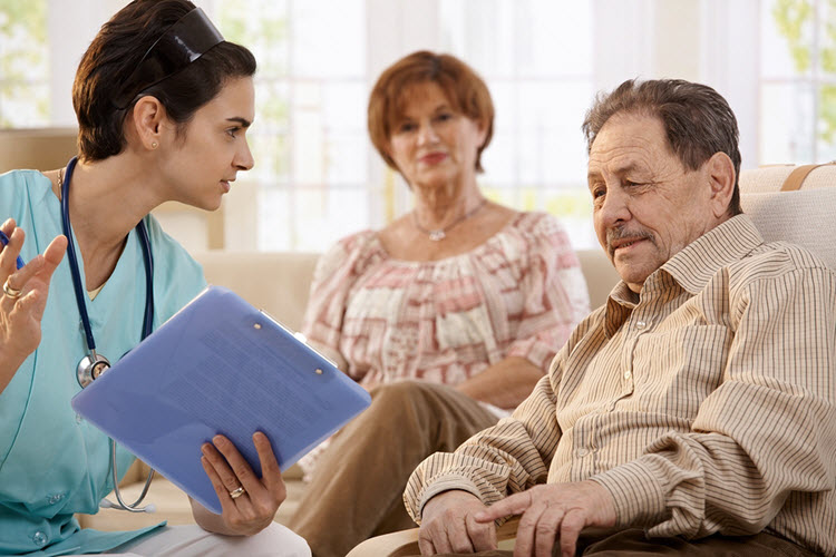 Community nurse checking in with a participant at home